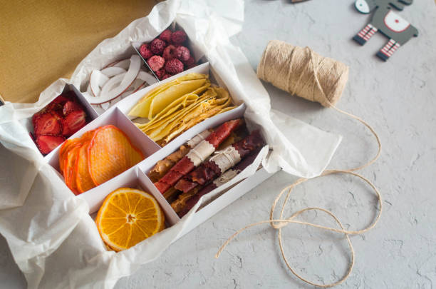 istock seasonal gift box with assorted dried chips on grey background. 1318398399