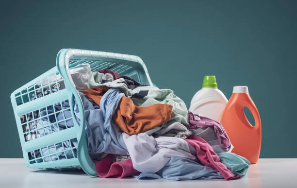 Laundry detergents and dirty clothes Laundry detergents and dirty clothes in a basket, blank copy space laundry stock pictures, royalty-free photos & images