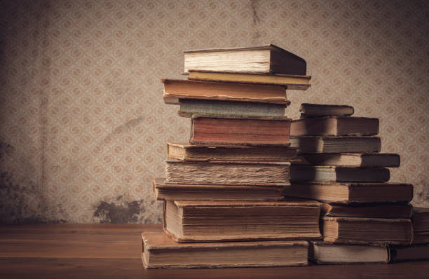 istock Old hardcover books on the table 1318399895