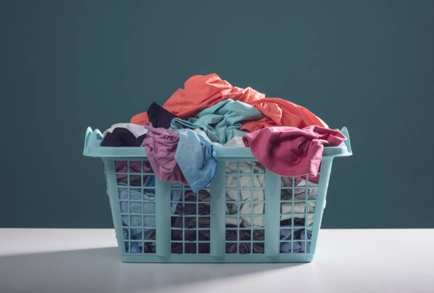 istock Laundry basket with dirty clothes 1318399901