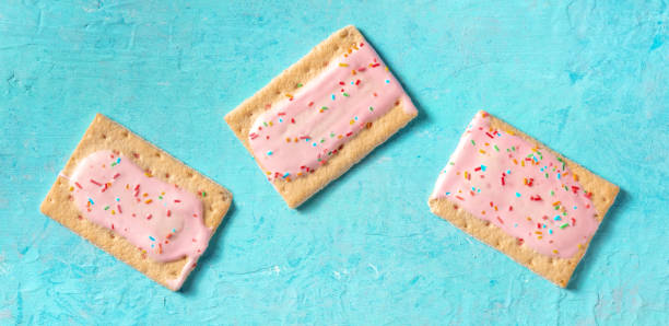 Pop tarts flat lay panorama on a blue background stock photo
