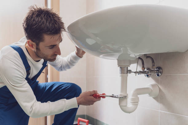 istock Plumber fixing a sink at home 1318400895