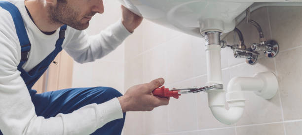 istock Plumber fixing a sink at home 1318400929