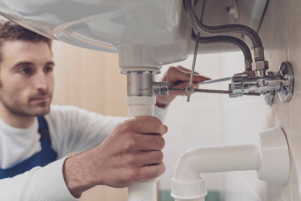 istock Plumber fixing a sink at home 1318400997