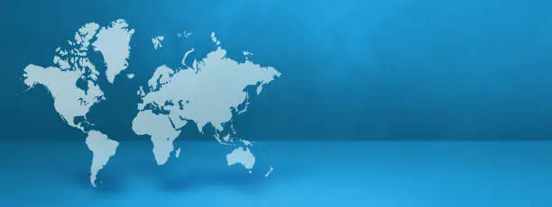 World map isolated on blue wall background. 3D illustration. Horizontal banner