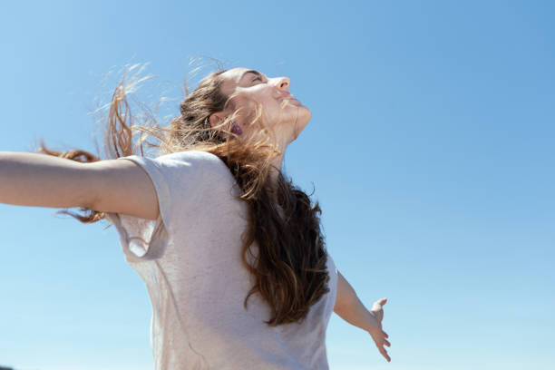 istock Pretty young woman breathing 1318403594