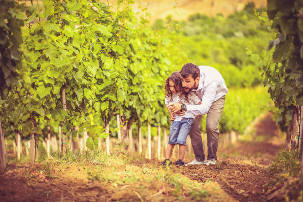 istock Father talking his son about agriculture. 1318405470