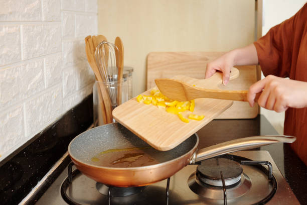 istock Woman frying bell pepper 1318405485
