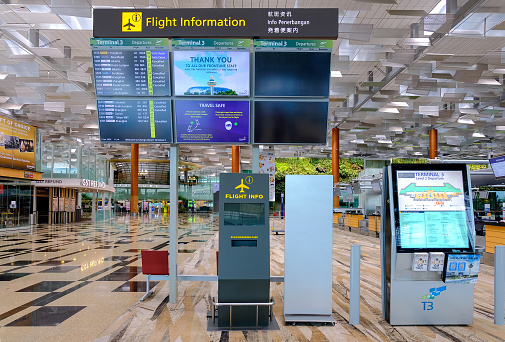 Singapore Jun2020 Flight information digital display screens, information panel at Changi Airport Terminal 3 check-in hall. No travellers during covid-19 coronavirus outbreak.