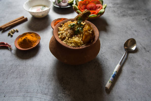 istock Popular Indian mughlai delicacy chicken biryani in an earthen pot 1318408059