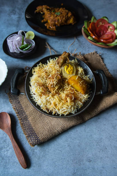 istock Biryani in a cooking pan. Top view. 1318408100