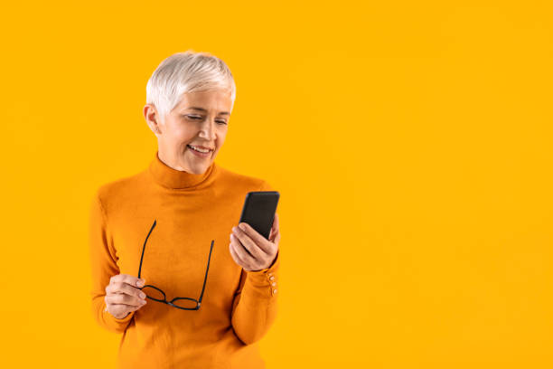 istock Senior Woman Writing a blog post 1318409232