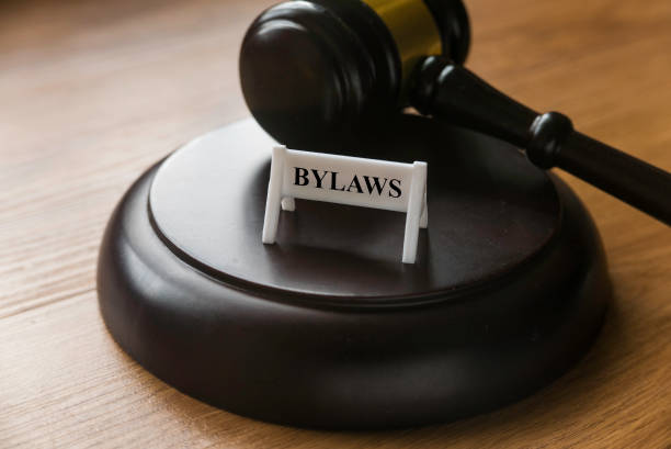 bylaws phrase with gavel on wooden background. business and law concept - gavel mallet law legal system imagens e fotografias de stock