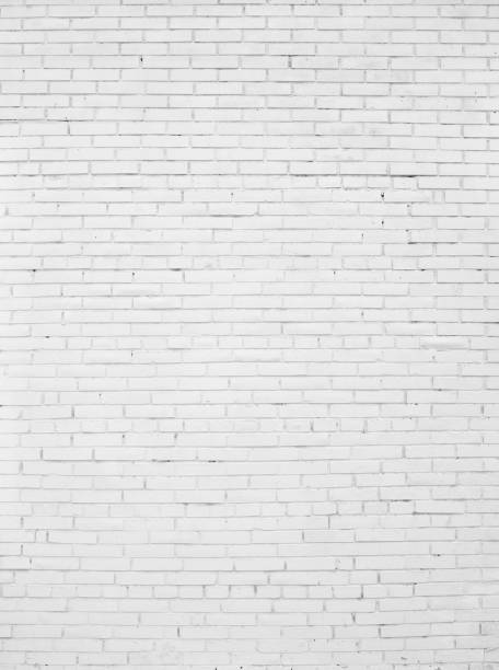istock Old Brick wall painted with white paint. 1318412790
