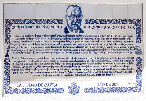 Cabra, Spain - May 19th, 2019: Memorial glazed tiled plaque to Camilo Jose Cela. Cabra, Cordoba, Spain
