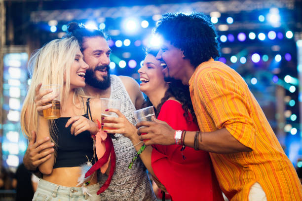 istock Happy young people attending festivals at summer having fun 1318416105