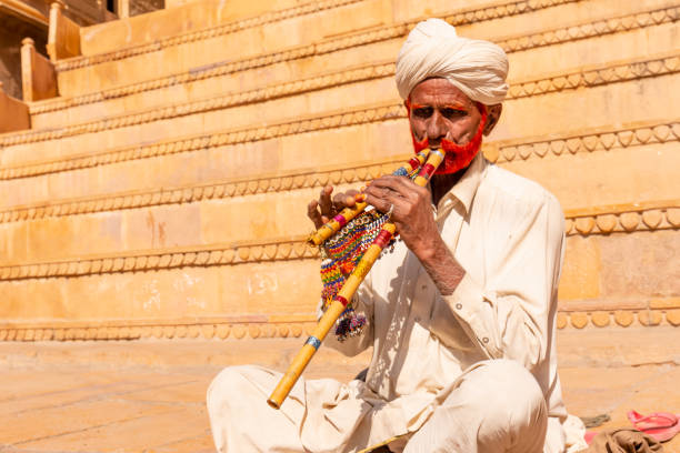 Joshpur, Rajasthan, India - November 2018: Rajasthani male artist with musical instruments and colorful turban.