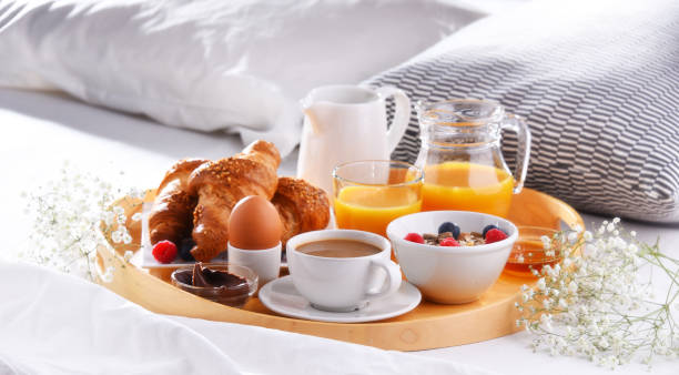 istock A tray with breakfast on a bed in a hotel room 1318419045
