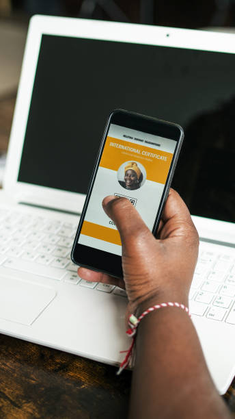 istock A black woman's hands hold a phone with a digital vaccination passport on display 1318423213
