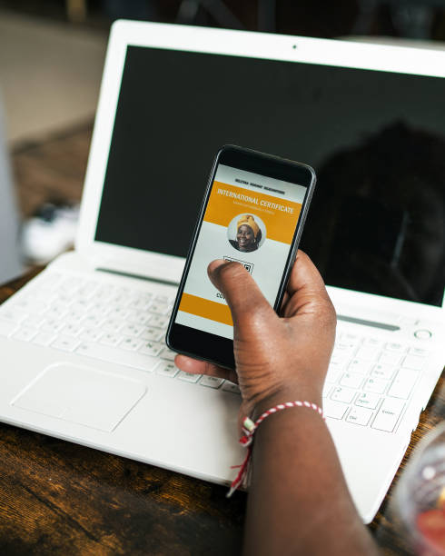 istock A black woman's hands hold a phone with a digital vaccination passport on display 1318423215