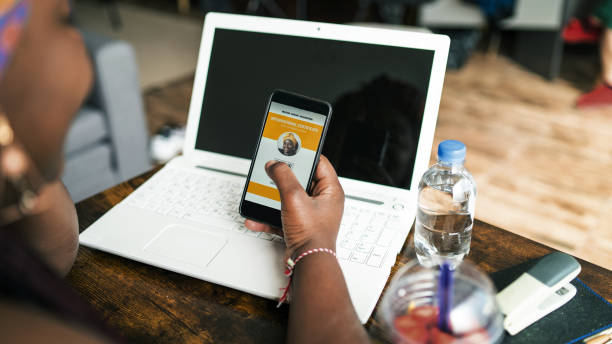 istock A black woman's hands hold a phone with a digital vaccination passport on display 1318423224