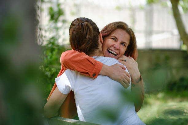 istock Happy women hugging each other 1318425502