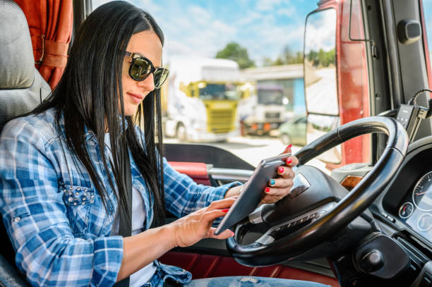 Female truck driver using a mobile app