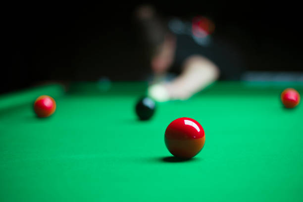 istock young man enjoying a game of billiards 1318428316