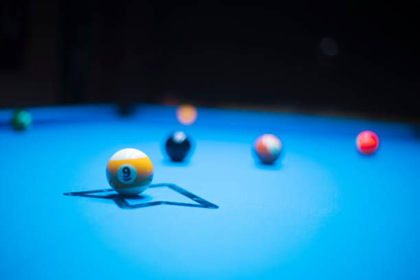 istock young man enjoying a game of billiards 1318428374