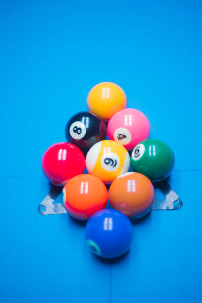 young man enjoying a game of billiards