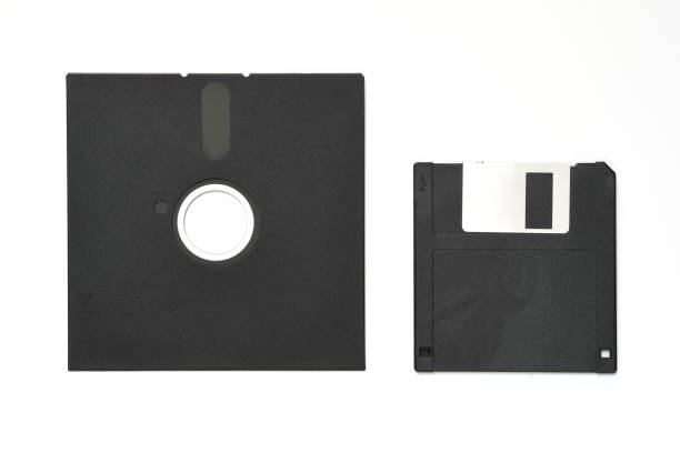 istock 5.25 inch and 3.5 inch floppy diskettes isolated on white 1318429421