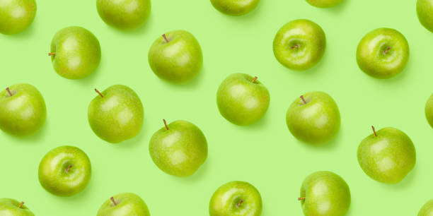 istock Green apple fruits over green seamless 1318431480