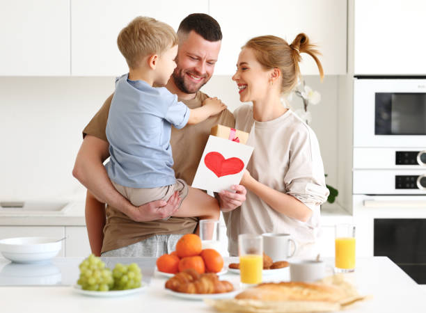 istock Little boy son congratulating daddy with Fathers day at home 1318431584