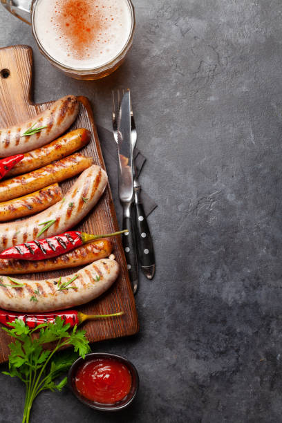 istock Grilled sausages with spices and herbs 1318432496