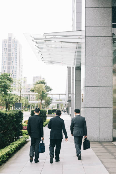 istock Businessmen walking down the street 1318432587