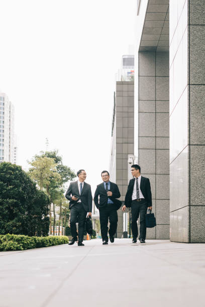 istock Businessmen walking down the street 1318432589