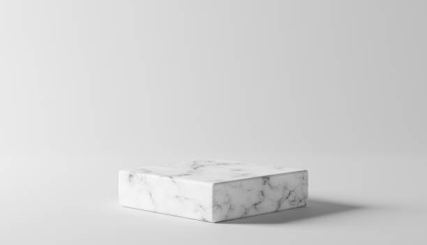 istock Empty white marble podium on white color background, Product Stand. 1318433622