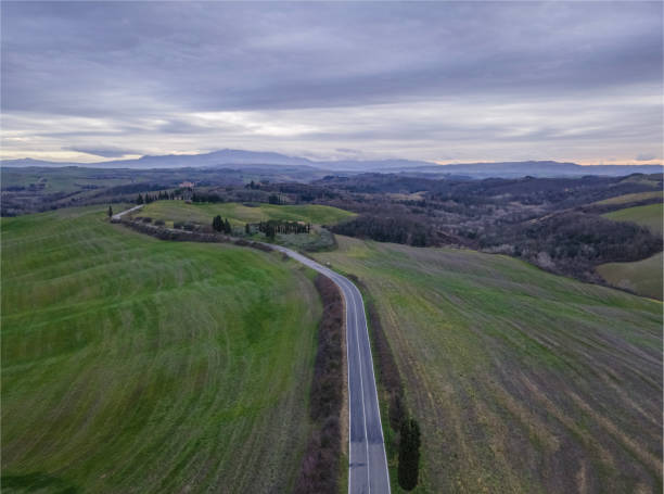 istock Tuscan countryside in a cloudy day 1318436371