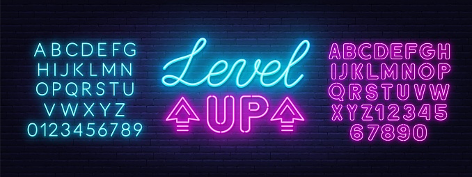 Level up neon sign on brick wall background . Neon blue and pink alphabet .