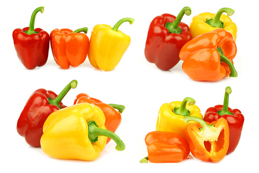 Red, orange and yellow bell pepper(capsicum) on a white background