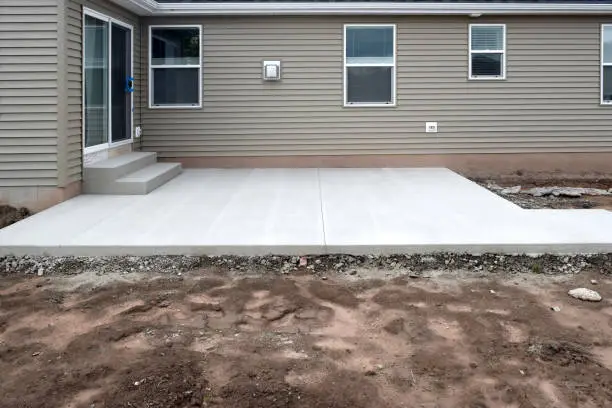 Photo of New Home House Construction Concrete Cement Foundation Patio Builders Smooth