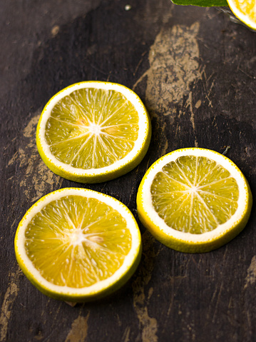 Fresh Mousambi OR Green lemon stock image on dark background.