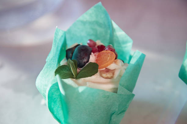 istock Wrapped fruit and mint cakes, an alternative to birthday cake. Sugar free. Top view. Copy space. Happy birthday concept or happy holidays 1318447566