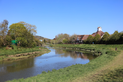 Lewes, England - May 07, 2021: Tesco store by the riverside in Lewes. Tesco is the UK's largest supermarket chain.