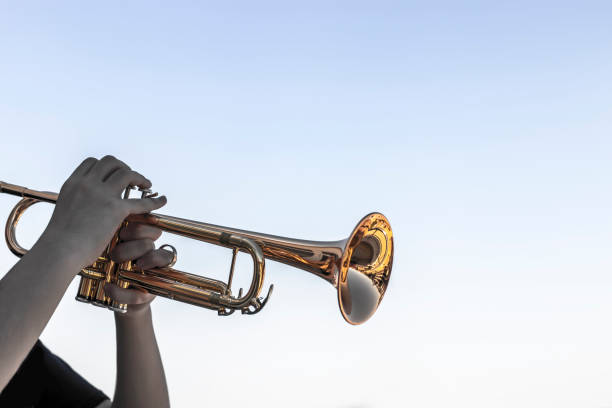 istock hands of boy playing trumpet, child's face not visible 1318449334