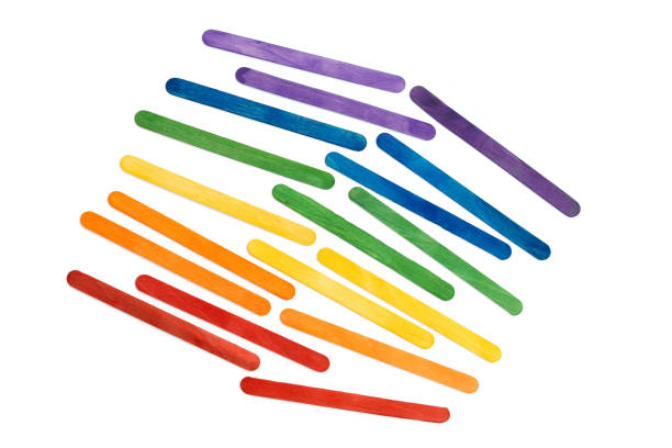 istock Rainbow color wooden ice cream sticks on white. Multicolored abstract 1318451819