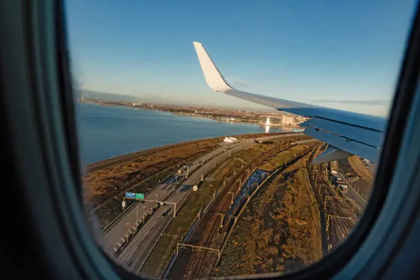 A Boeing 737 of Ryanair low cost company landing at Copenhagen. View of the motorway near the airport Kastrup.
