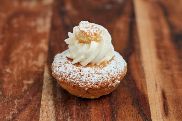 istock Small dessert of sponge cake and coconut cream. 1318454097