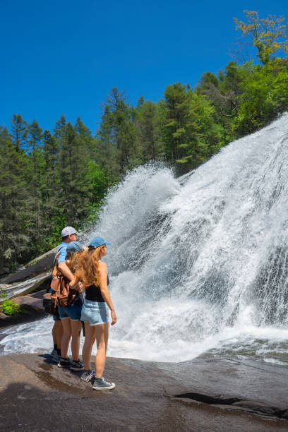 istock Family enjoying time together by the waterfall. 1318455455