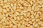 Roasted and salted peanuts, snack food, background, from above